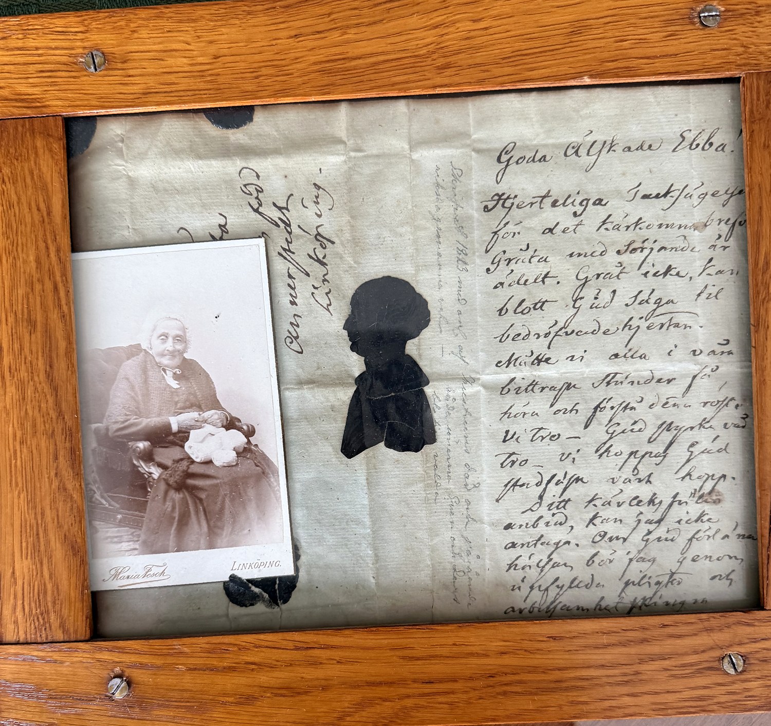 The framed letter, silhouette and photograph